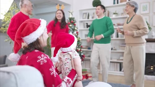 Happy Family Dancing at Christmas Time