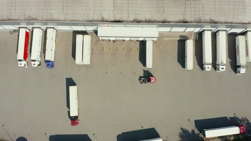 Aerial View of Trucks Parked at the Loading Dock of the Warehouses