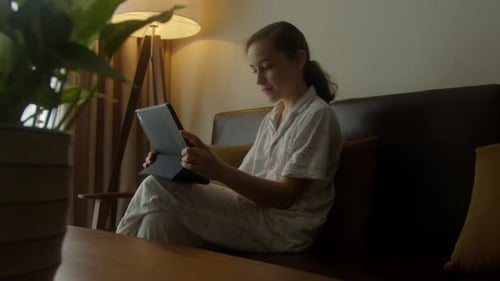 Child Playing Game on Tablet or Kid Girl Computer Learning to Wow Excited and Fun Study Online In