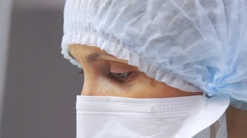 Female Scientist Portrait. Close Up of Laboratory Worker Face in Protective Mask