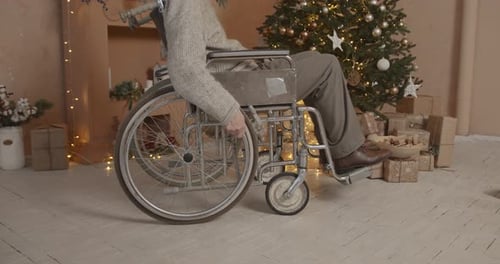Person in Wheelchair in Christmas Decorated Home