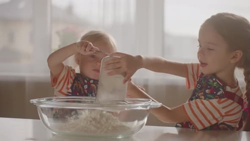 Young Children Baking Together in Kitchen