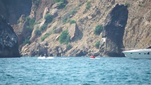 Jet Ski and Boat on the Clear, Blue Ocean