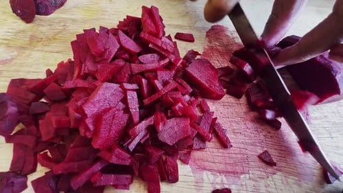 Cutting beet with sharp chef knife shot, cooking process, preparing ingredients for Tar Tar, slow mo