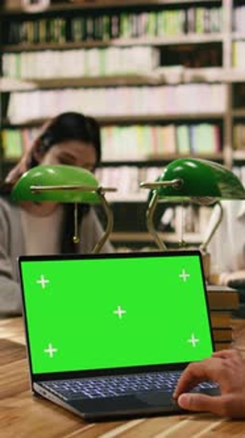 Vertical Video Chroma Key Isolated Screen on Laptop with Student in Overtheshoulder Shot