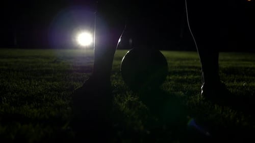 Soccer Player Athlete Training Foot Ball Sport on Soccer Field at Night