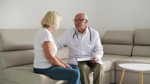 Senior woman have consultation in the clinic by male doctor