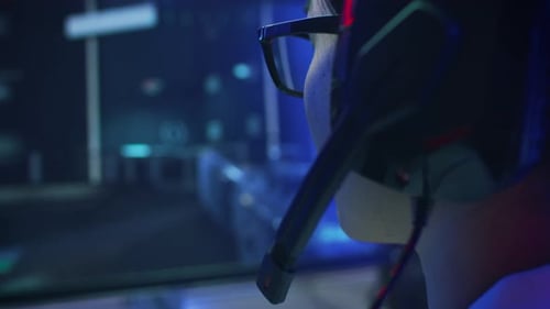 Close-up Shot of Professional Gamer Playing in First-Person Shooter Online Video Game on His Person