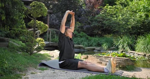 Healthy African American Man Exercising Ar Park Outdoor Practicing Yoga