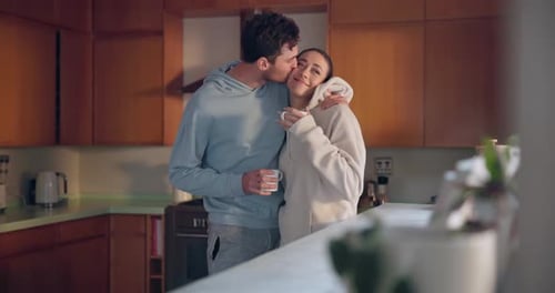 Loving Couple Embracing in Cozy Kitchen Setting