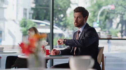 Serious Businessman Checking Time at Hand Watch Sitting Cafe Man Waiting