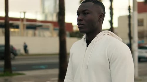 An man walks in the evening in a beautiful southern city