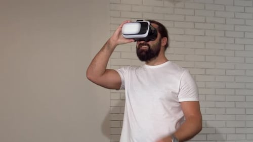 Man Using Virtual Reality Headset Indoors