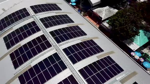 Aerial View of Solar Panels on Modern Building Roof
