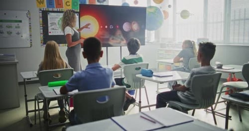 Elementary School Students Studying Basic Information About Solar System and Planets