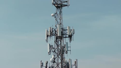 Television or Telephone Tower in a Cityscape at Day Time Zoom Aerial Drone Shot
