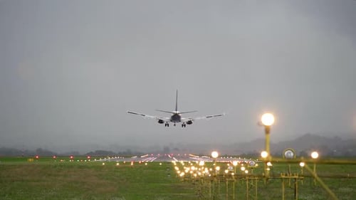 Plane Approaching Airport Runway for Landing