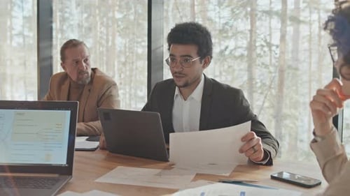 Business Team Meeting in Modern Workplace