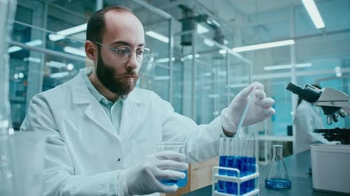 Bearded Man with Glasses Working in Science Lab