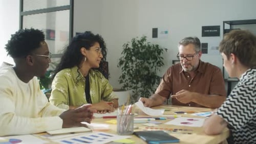 Multiethnic Team Discussing Creative Project