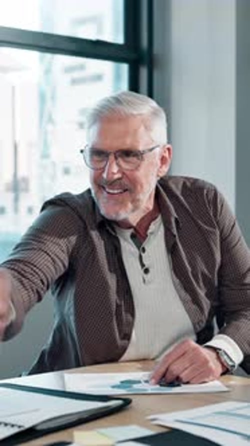 Man Speaking and Clapping in Office Setting