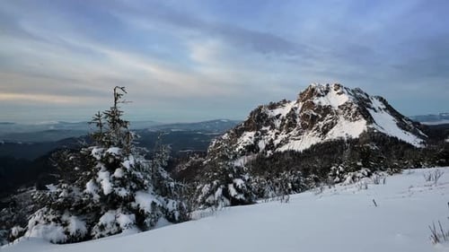 Majestic Rocky Mountain Peak in Winter Landscape End of Day Timelapse