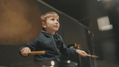 Young Talented Boy Playing Drums in Studio