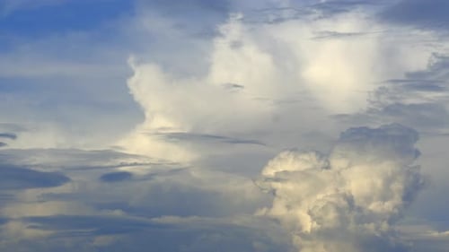 Billowing White Clouds in the Blue Sky