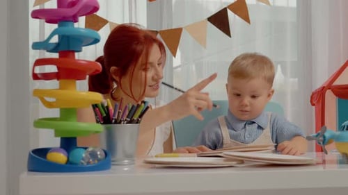 Mother and Child Drawing Together at Play Table
