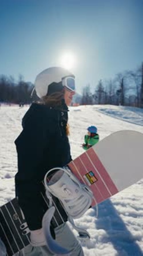 Woman Snowboarding in Winter Landscape