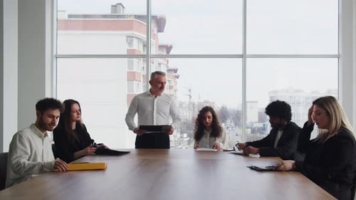 Diverse Team Having Productive Meeting in Modern Office