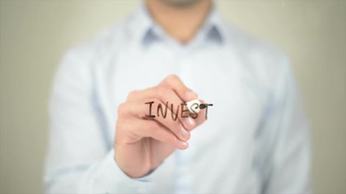 Writing 'Invest' on Transparent Surface