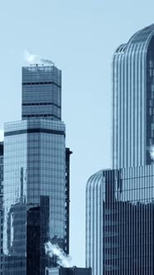 Modern Skyscrapers Rise Into Blue Sky in City