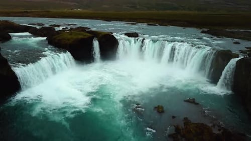 Aerial landscape view over Godafoss waterfall, Iceland, on a cloudy day