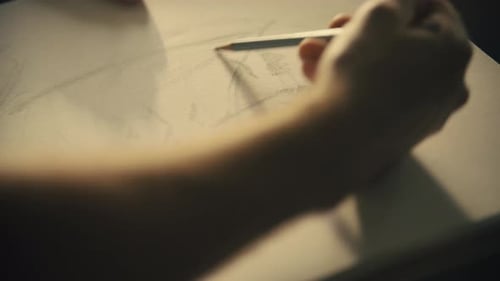 Sketching with a Pencil on Paper Close Up