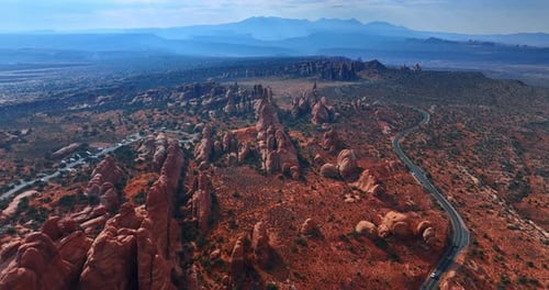 Breath-taking scenery of the rounded rocks in the desert covered with shrubs.