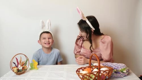46 1. A girl and her younger brother enjoy an Easter chocolate egg. Celebrating Easter in the family