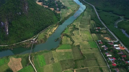 Agriculture, mountains and aerial of village by river for travel destination
