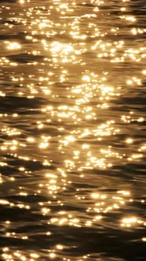The sea's surface glittered with sparks.