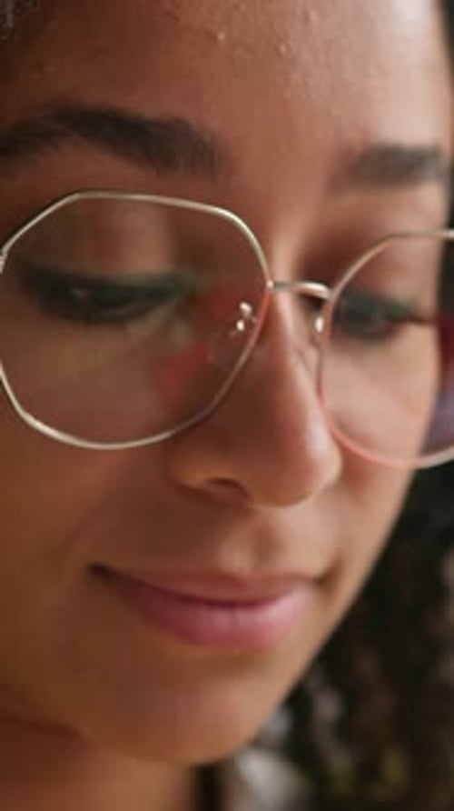 Close Up of Smiling Woman with Glasses Indoors
