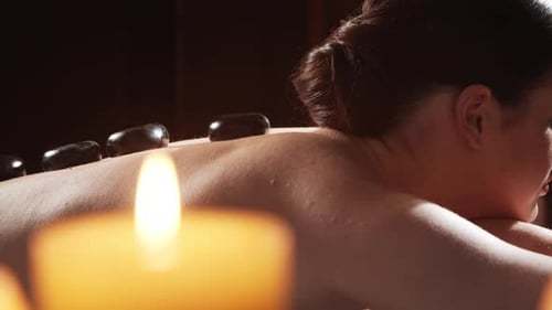 Young Healthy and Beautiful Woman Gets Massage Therapy in the Spa Salon The Concept of Healthy