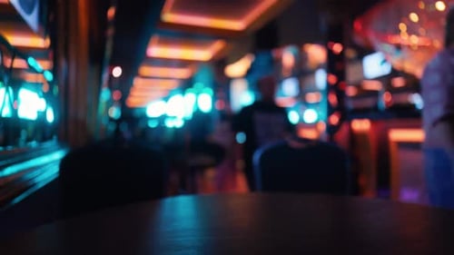 Blurred Interior of a Busy Bar with Neon Lighting