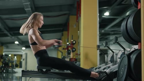 Athletic Woman Doing Seated Row Training Indoors