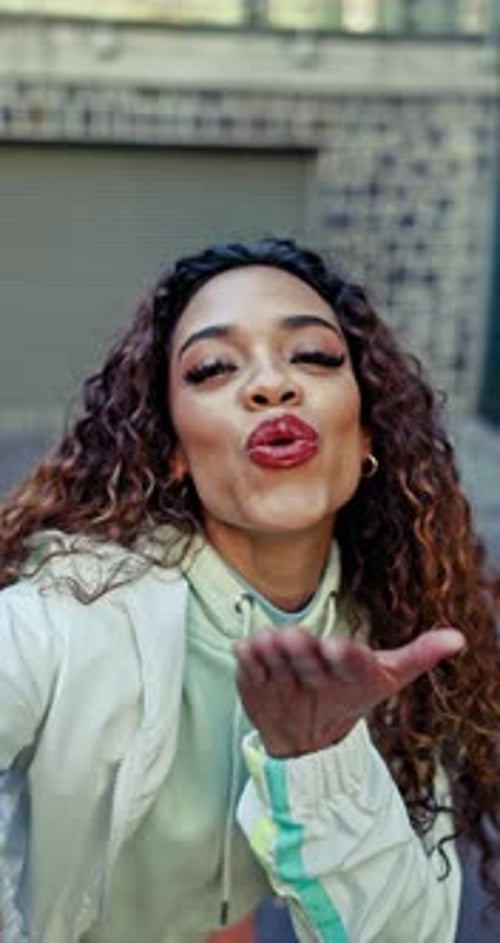 Woman influencer, kiss or online selfie in city for social media, fashion or content creator