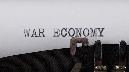 The phrase WAR ECONOMY is typing on a retro typewriter.