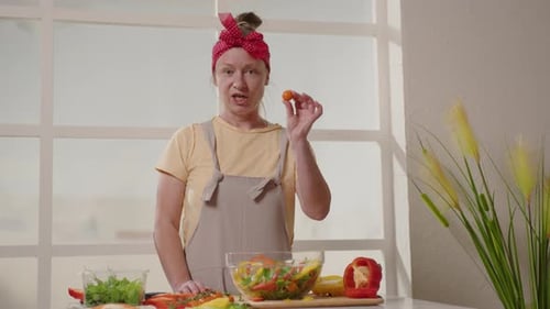 Woman Preparing Fresh Salad in Bright Kitchen