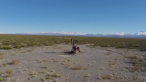 Solo Oil Pump Jack Extracting Fuel In Vast Desert Landscape