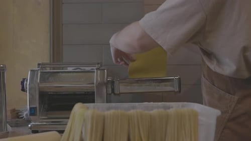 Chef Uses a Pasta Cutting Machine Fresh Homemade Pasta Fresh Handmade Pasta Coming Out From Machine