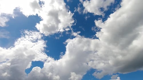 Clouds Drifting across Blue Sky Time-Lapse
