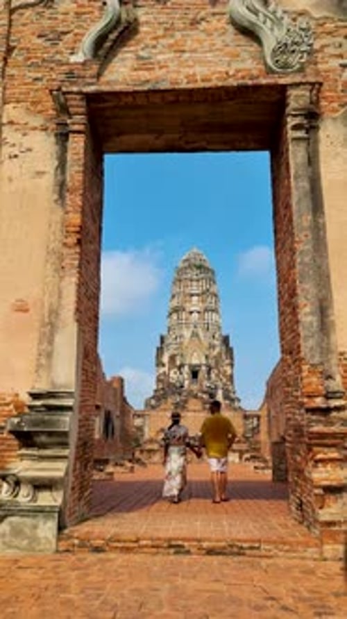 Ayutthaya Thailand Wat Ratchaburana Couple Men and Women with a Hat Visiting Ayyuthaya Thailand